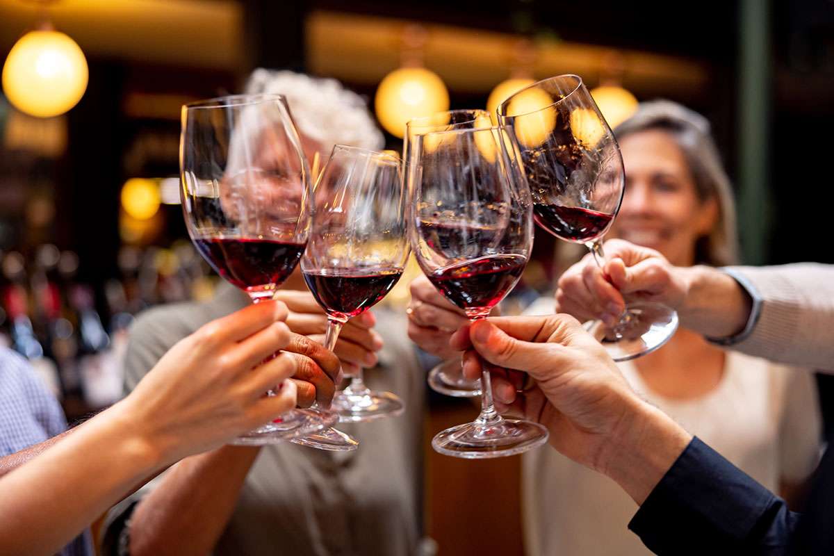 Group of people toasting Red Wine