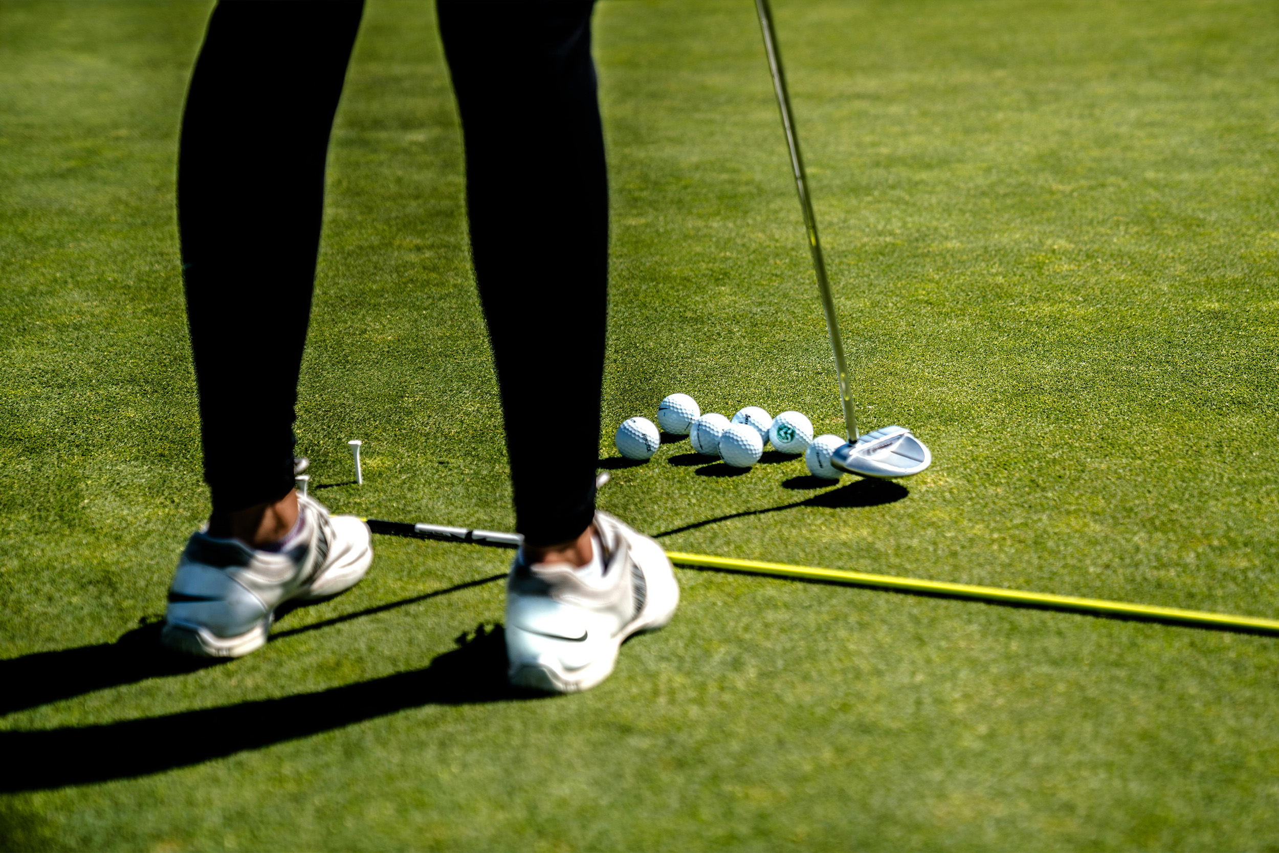Couple,playing,golf,driving,buggy,and,talking,over,clubs